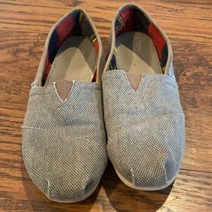 Tom’s brown slip-ons
